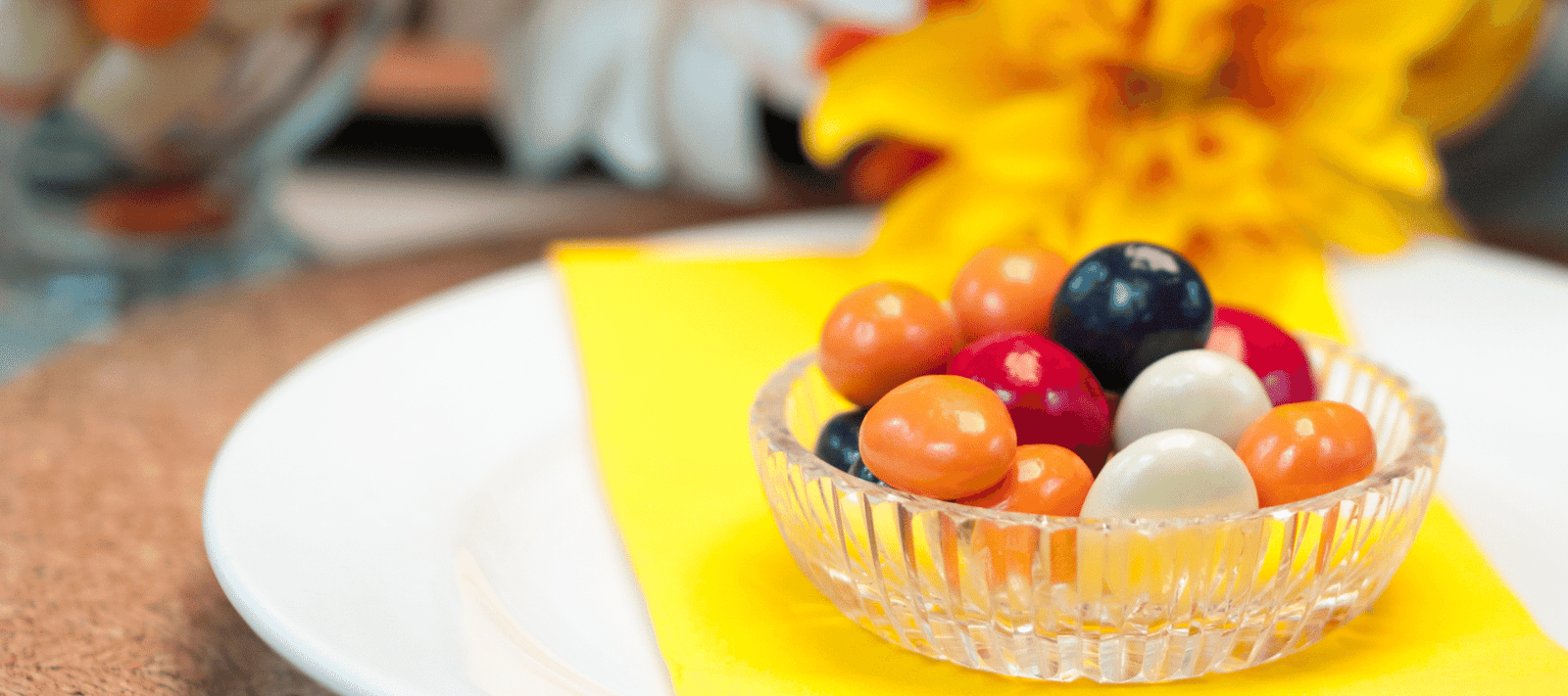 Dilettante Chocolates Chocolate-Covered Fruit on a plate with a yellow napkin
