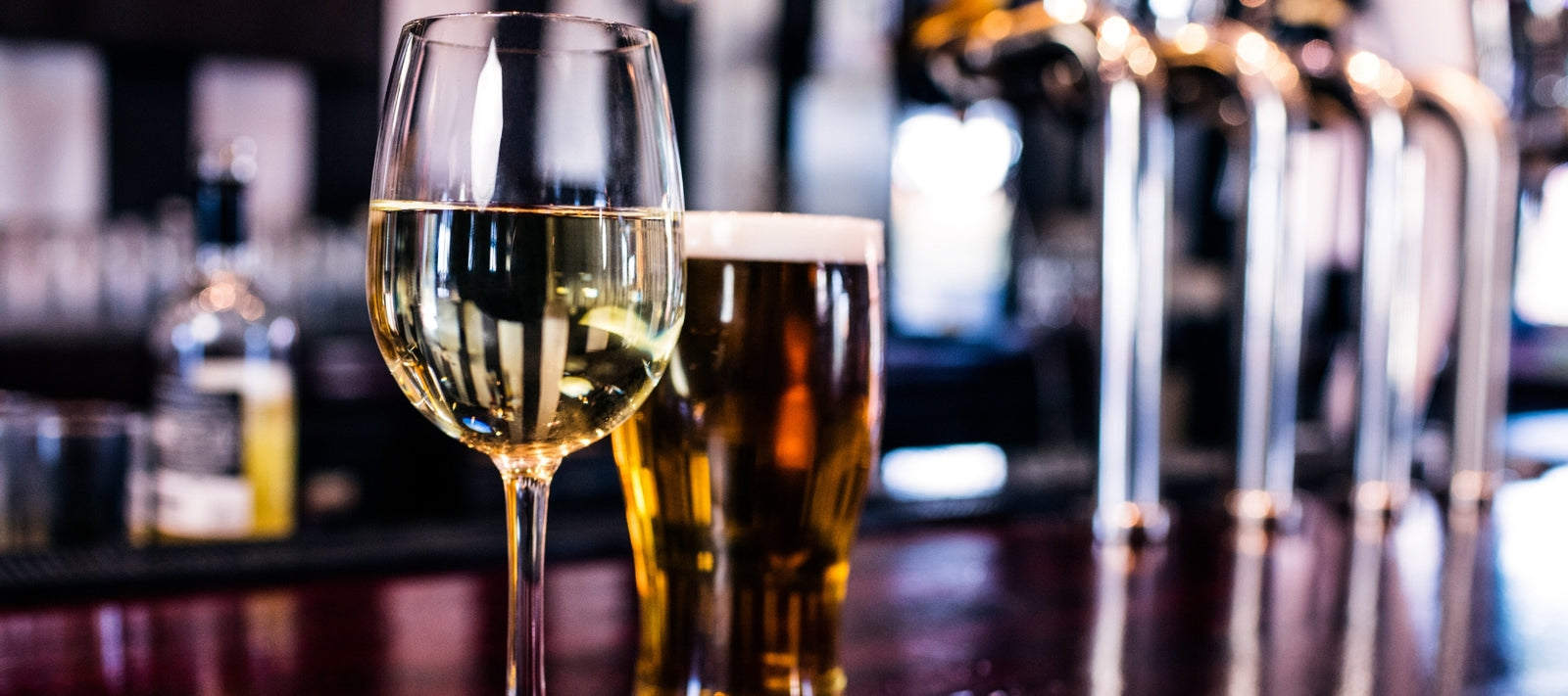 Close up of beer and wine on a countertop