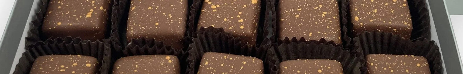 Espresso Chocolate Salted Caramels and other premium chocolates available for purchase in bulk boxes.