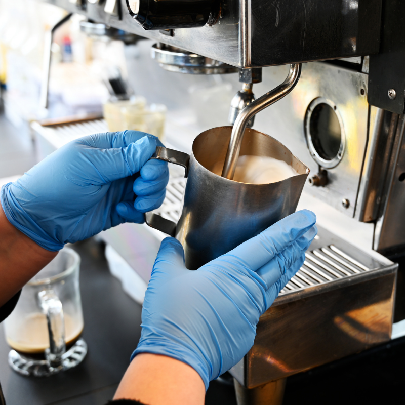 Dilettante Mocha Café barista pouring coffee into a cup