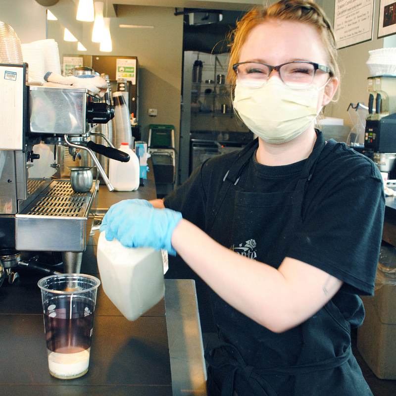 Dilettante Mocha Café barista preparing a coffee drink
