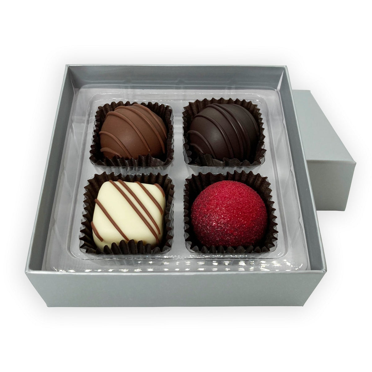 Dilettante&#39;s 4-piece chocolate truffle gift box featuring praline, raspberry, and light and dark Ephemere flavors