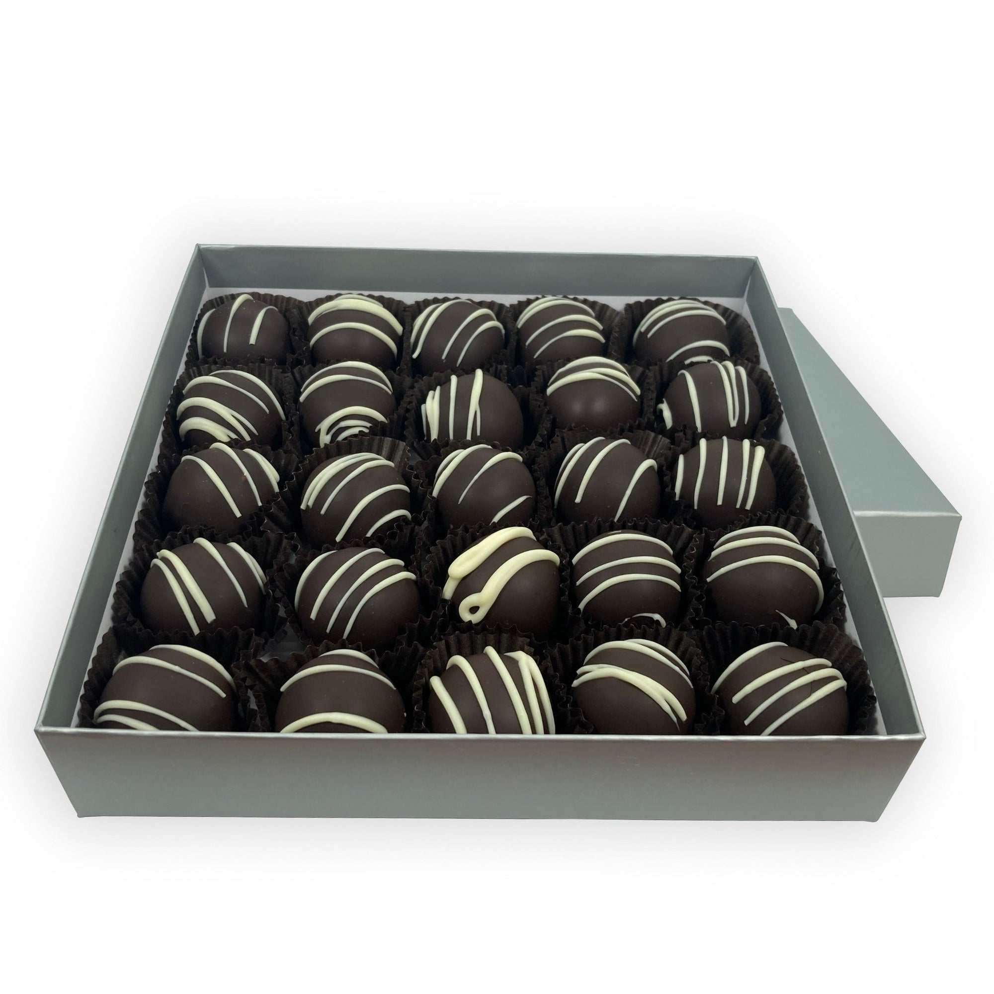 Dilettante Chocolates L'Orange Truffles coated with dark chocolate and embellished with white chocolate in a 25-piece bulk box